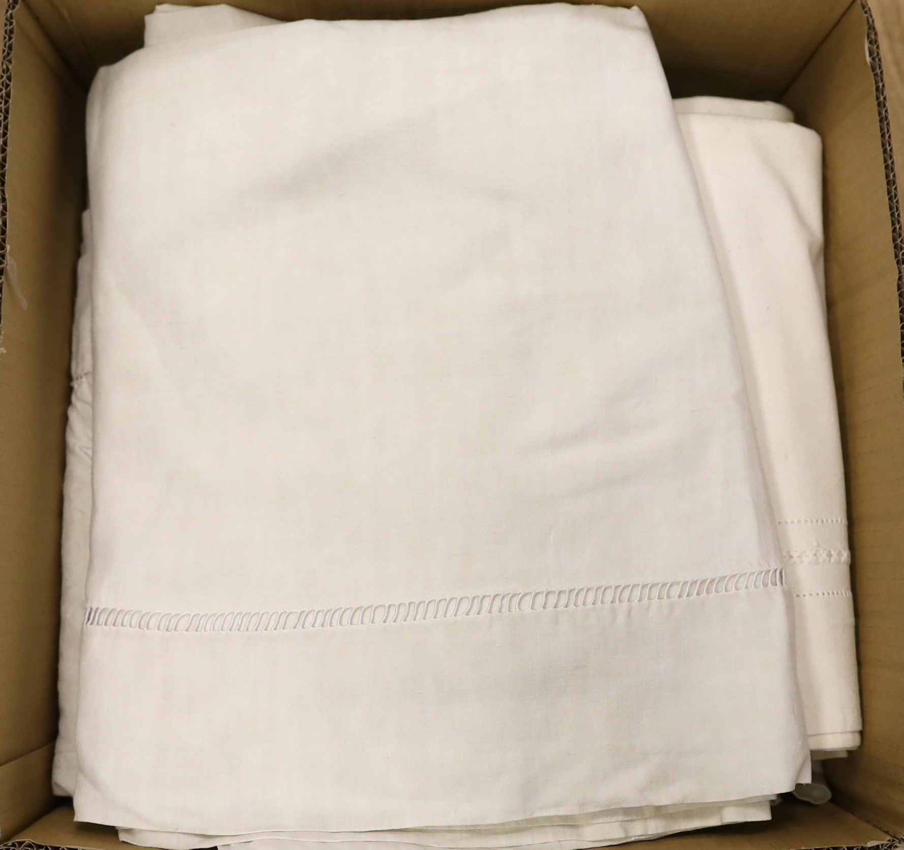 A collection of eight French provincial coarse linen sheets with embroidered and monogrammed turnbacks